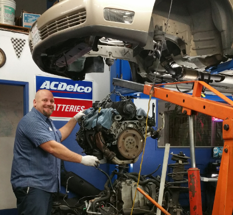 Mechanic working on car part